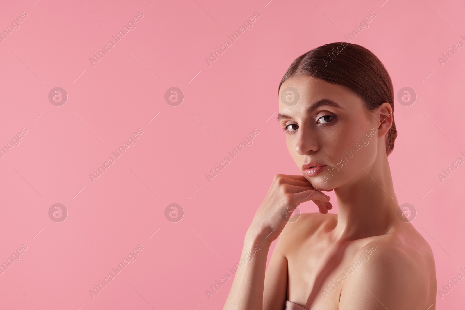 Portrait of beautiful young woman on pink background. Space for text Photo of Portrait of beautiful young woman on pink background. Space for text