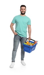 Photo of Man with shopping basket full of products on white background
