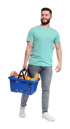 Photo of Man with shopping basket full of products on white background