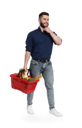 Photo of Man with shopping basket full of products on white background