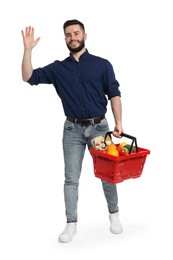 Photo of Man with shopping basket full of products on white background