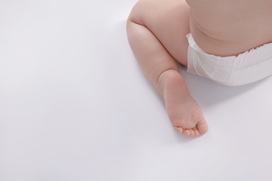 Photo of Cute little baby on white background, closeup