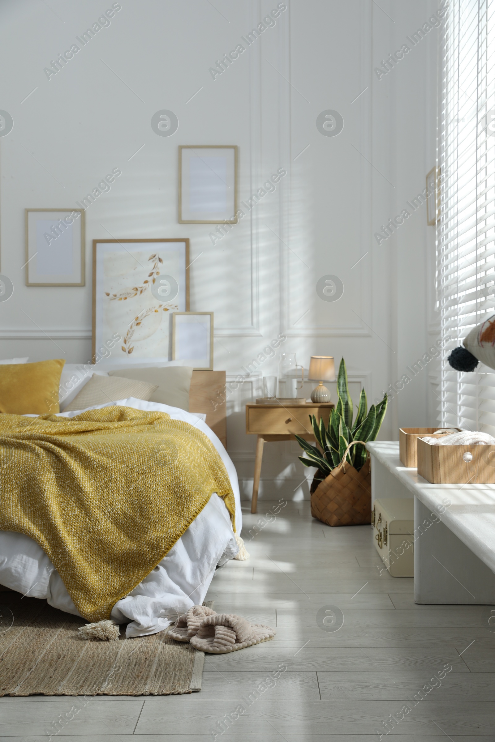 Comfortable bed with soft linens in stylish room. Home textile Photo of Comfortable bed with soft linens in stylish room. Home textile