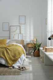 Photo of Comfortable bed with soft linens in stylish room. Home textile