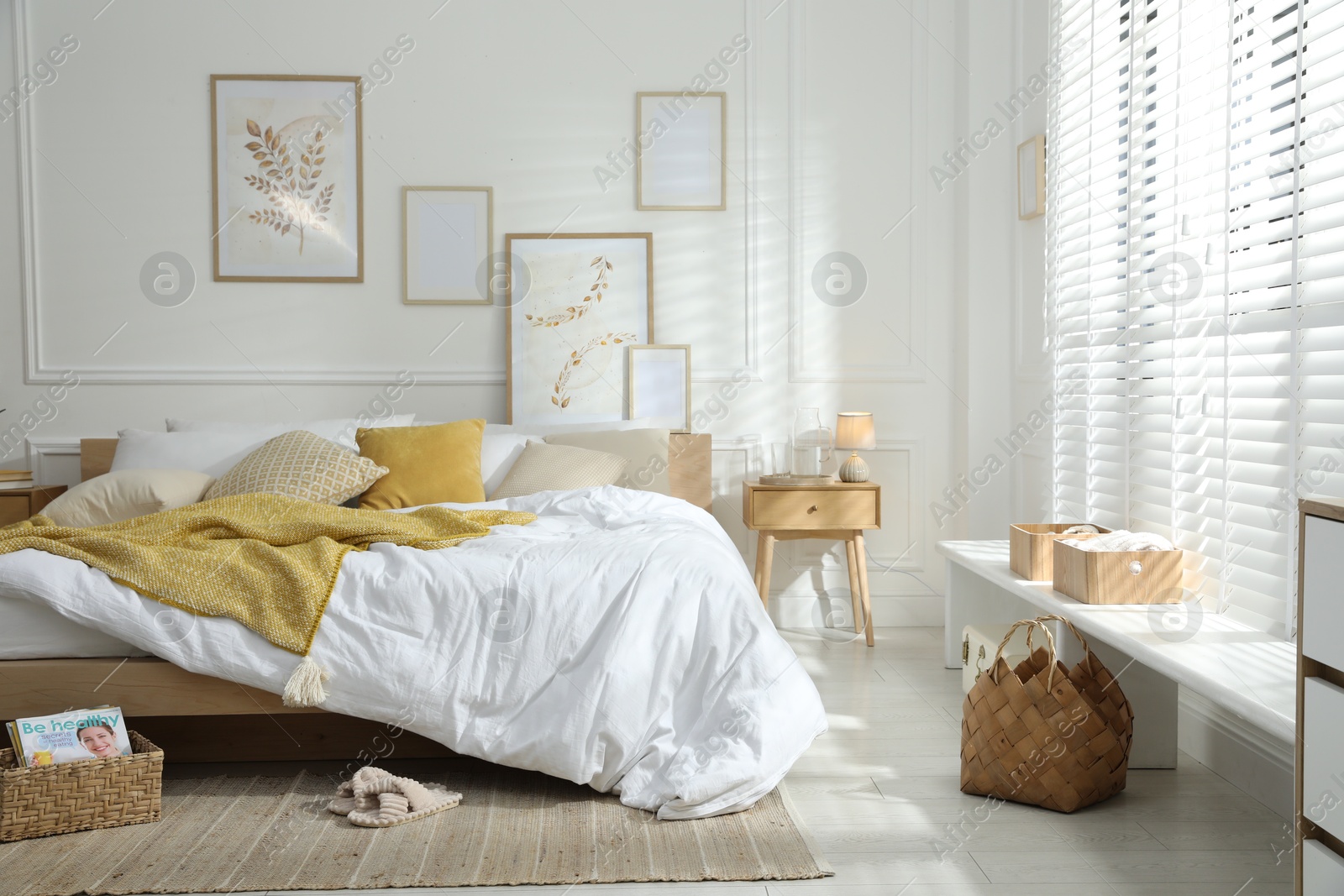 Comfortable bed with soft linens in stylish room. Home textile Photo of Comfortable bed with soft linens in stylish room. Home textile
