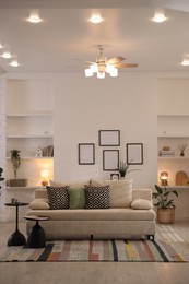 Photo of Comfortable sofa with cushions in room. Interior design
