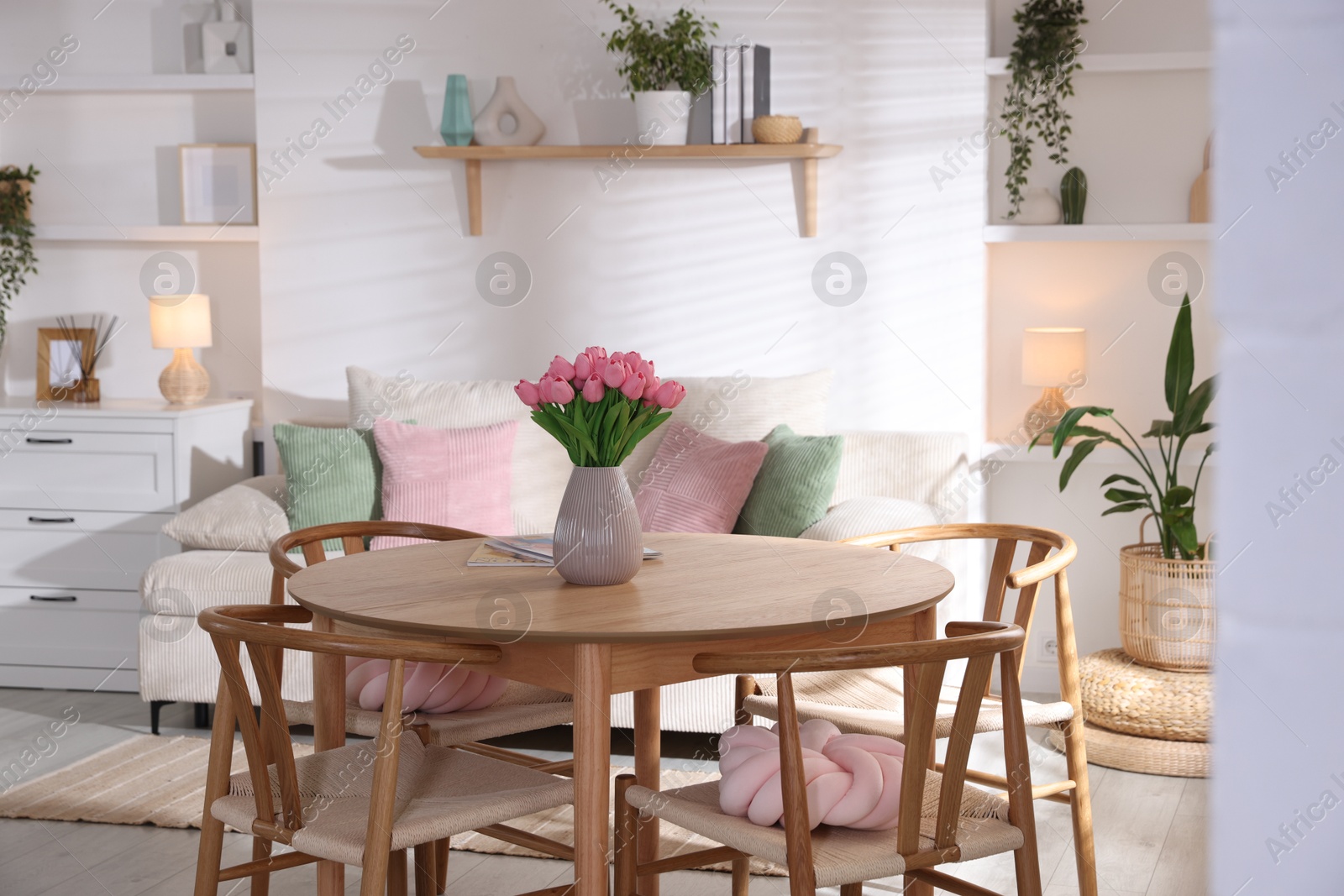 Stylish dining table with chairs in room. Interior design Photo of Stylish dining table with chairs in room. Interior design