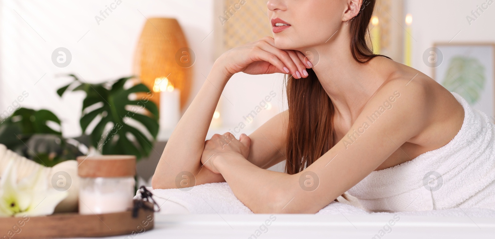 Beautiful woman relaxing on massage couch in spa salon, selective focus Photo of Beautiful woman relaxing on massage couch in spa salon, selective focus