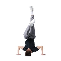 Photo of Boy in stylish clothes dancing on white background