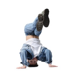 Photo of Boy in stylish clothes dancing on white background
