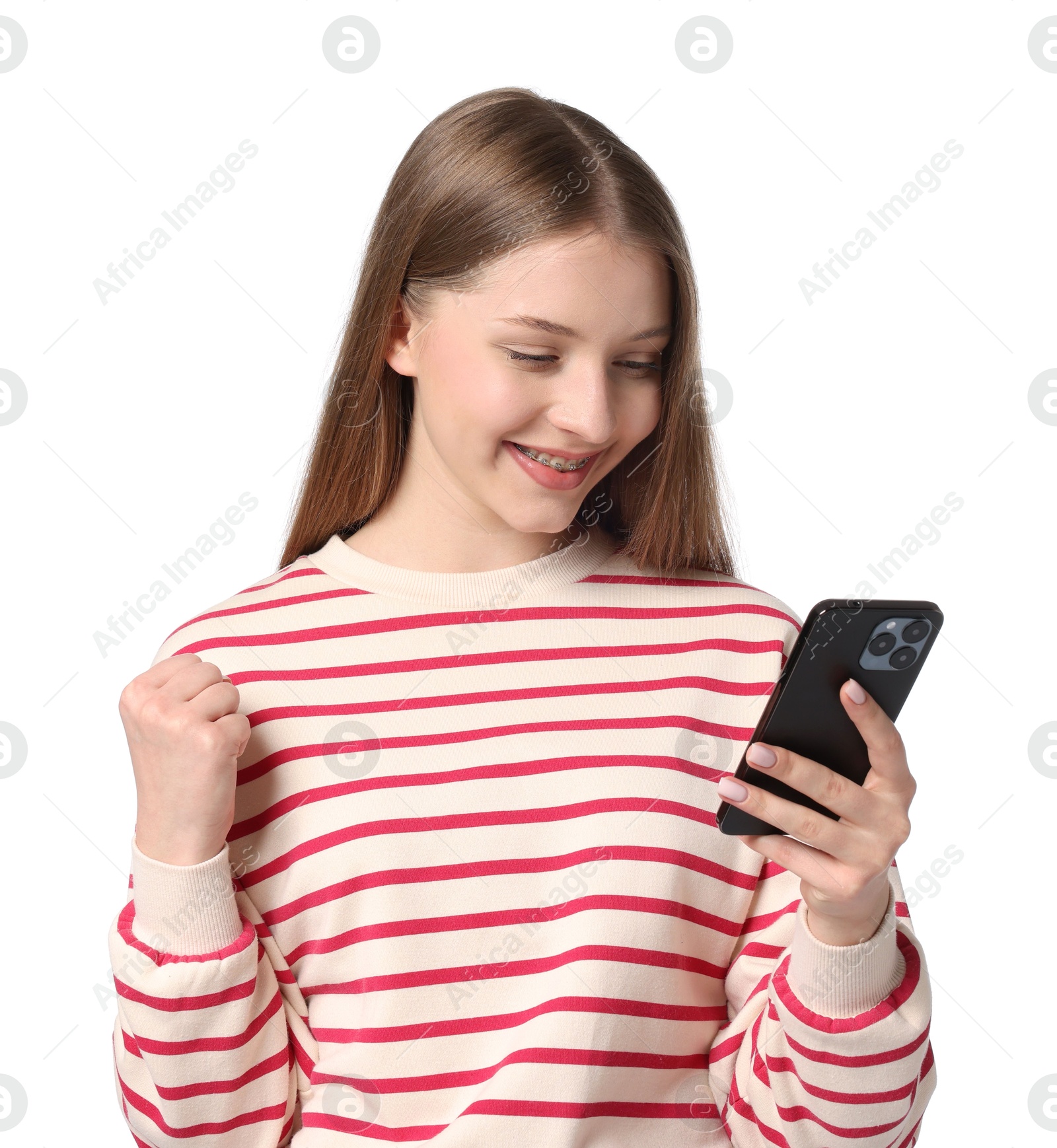 Excited teenage girl with smartphone on white background Photo of Excited teenage girl with smartphone on white background