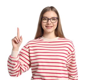 Photo of Teenage girl pointing at something on white background