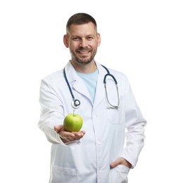 Photo of Nutritionist with green apple and stethoscope on white background