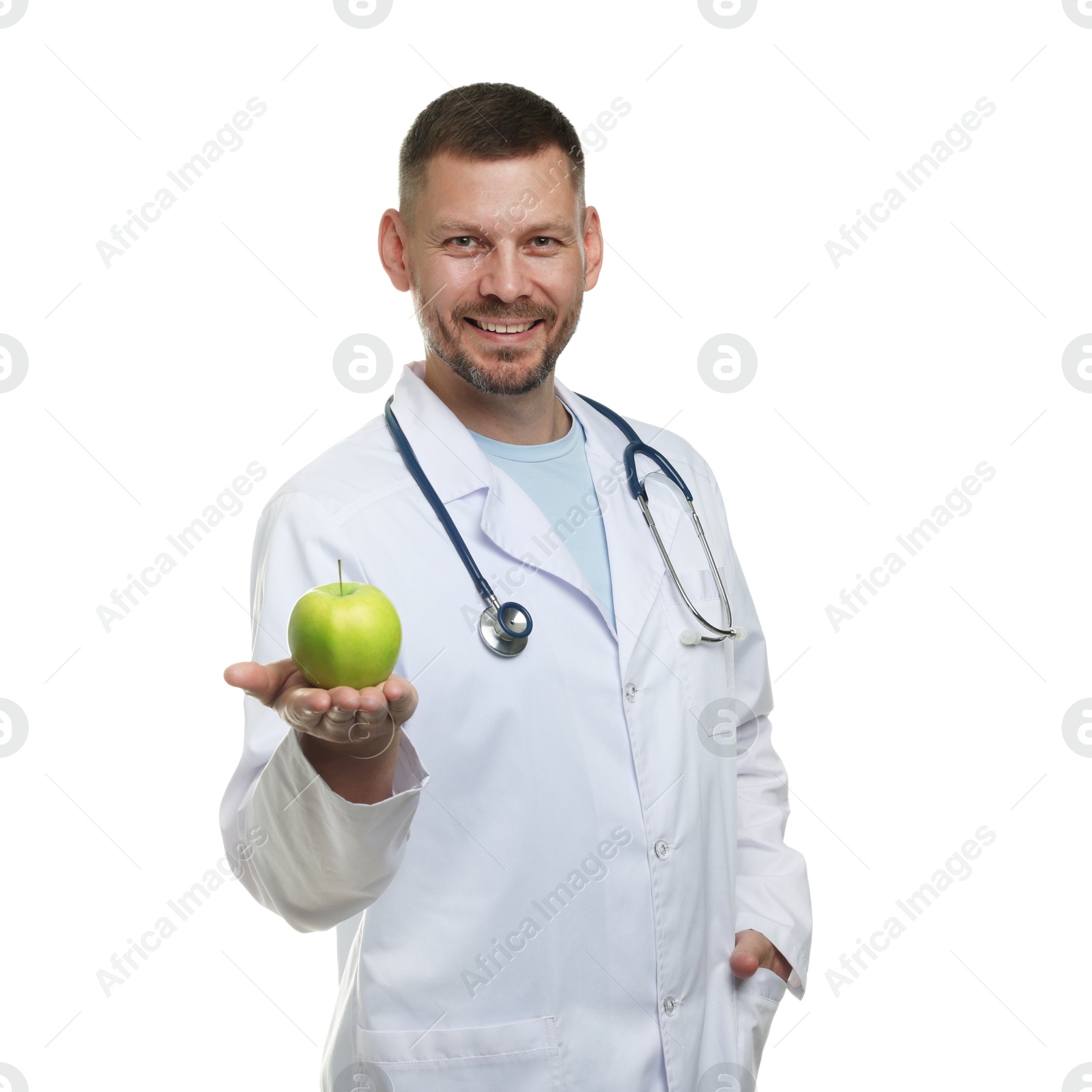 Nutritionist with green apple and stethoscope on white background Photo of Nutritionist with green apple and stethoscope on white background