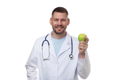 Photo of Nutritionist with green apple and stethoscope on white background