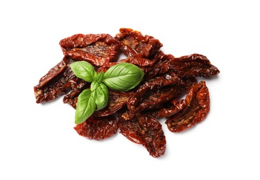 Photo of Delicious sun dried tomatoes and basil isolated on white, top view