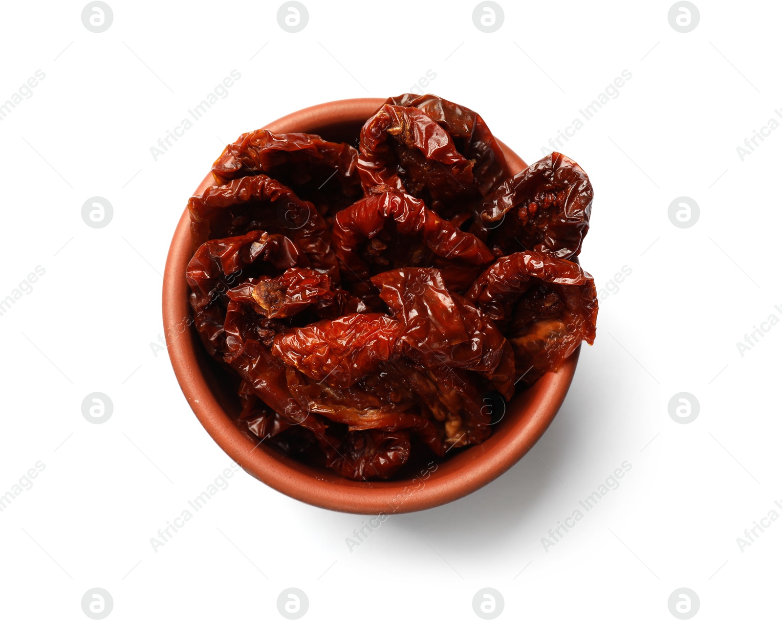 Delicious sun dried tomatoes in bowl isolated on white, top view Photo of Delicious sun dried tomatoes in bowl isolated on white, top view