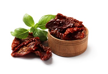 Photo of Delicious sun dried tomatoes and basil isolated on white