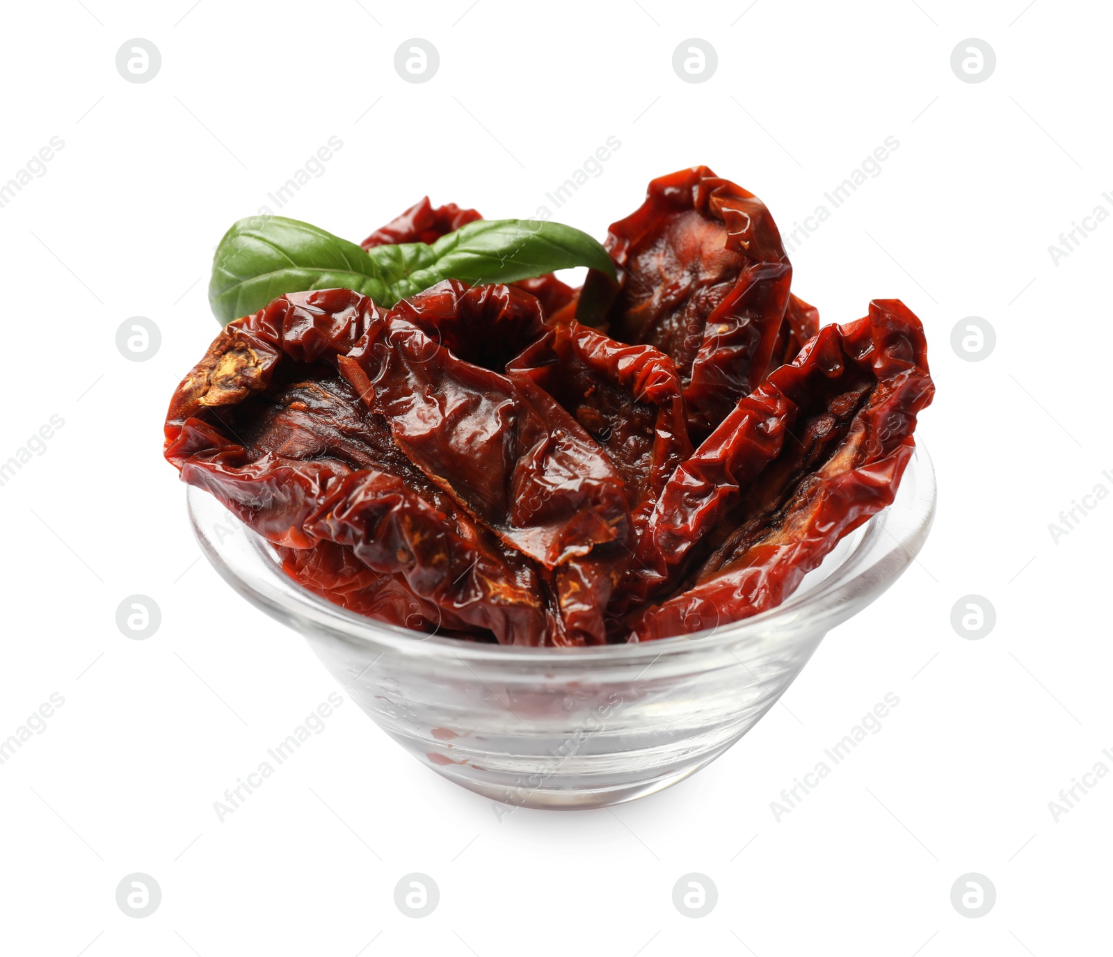Delicious sun dried tomatoes with basil in glass bowl isolated on white Photo of Delicious sun dried tomatoes with basil in glass bowl isolated on white
