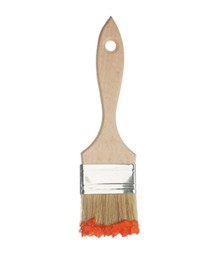 Photo of Brush with orange paint isolated on white
