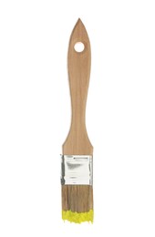 Photo of Brush with yellow paint isolated on white