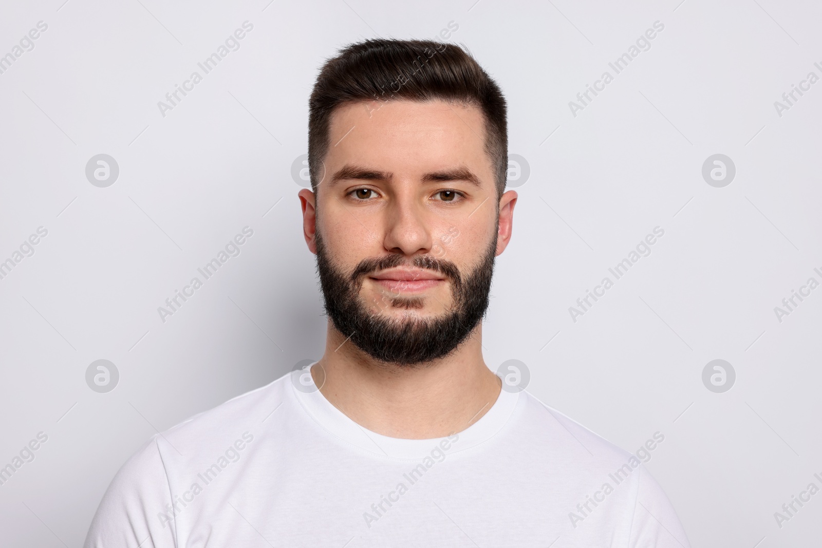 Portrait of handsome man on light background Photo of Portrait of handsome man on light background
