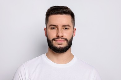 Photo of Portrait of handsome man on light background
