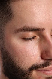 Photo of Handsome man before eyebrows correction, closeup view