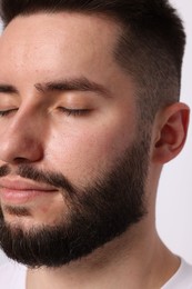 Photo of Man before eyebrows correction on light background, closeup