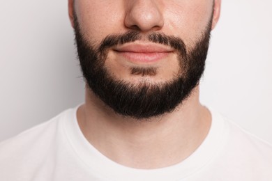 Photo of Man before shaving on light background, closeup