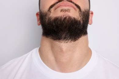 Photo of Man before shaving on light background, closeup