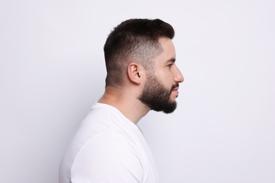 Photo of Man before scoliosis treatment on light background