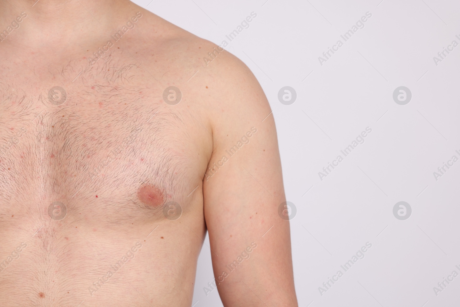 Man standing on light background, closeup. Space for text Photo of Man standing on light background, closeup. Space for text