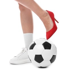 Photo of Woman in high heeled shoe and sneaker with soccer ball on white background, closeup