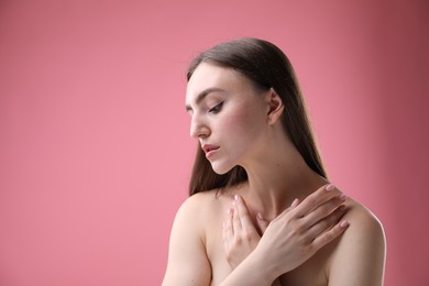 Photo of Portrait of beautiful woman on pink background. Space for text