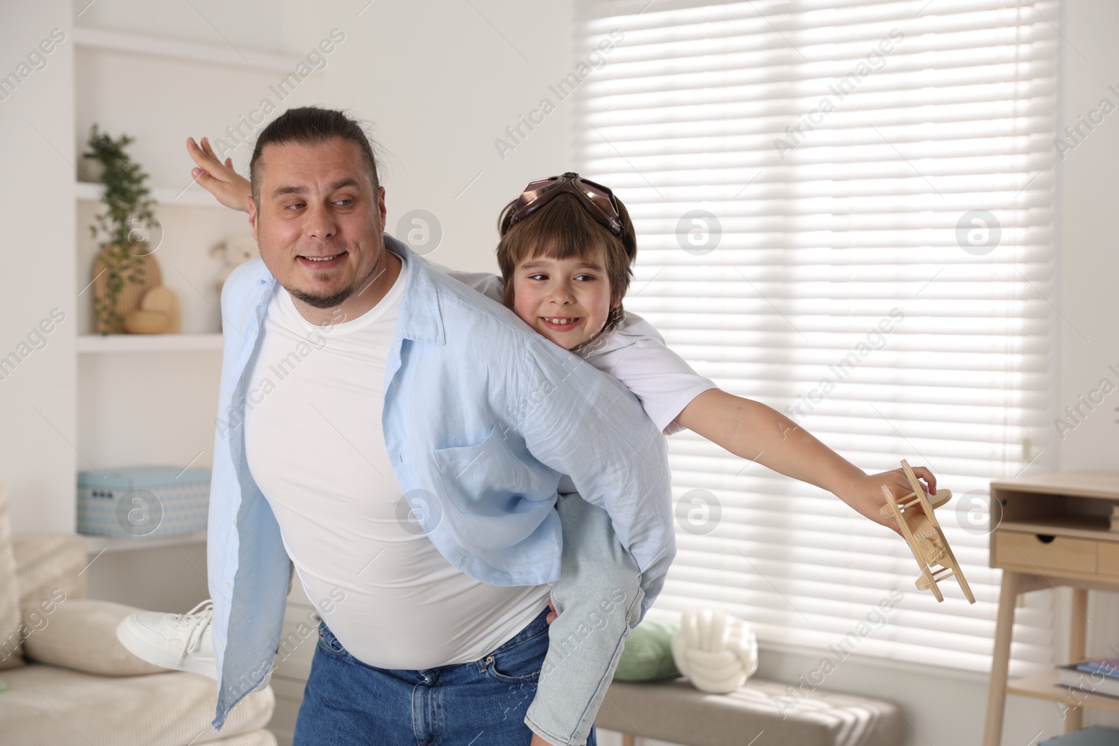 Father and his son spending time together at home Photo of Father and his son spending time together at home