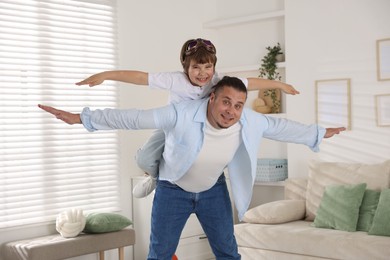 Photo of Father and his son spending time together at home