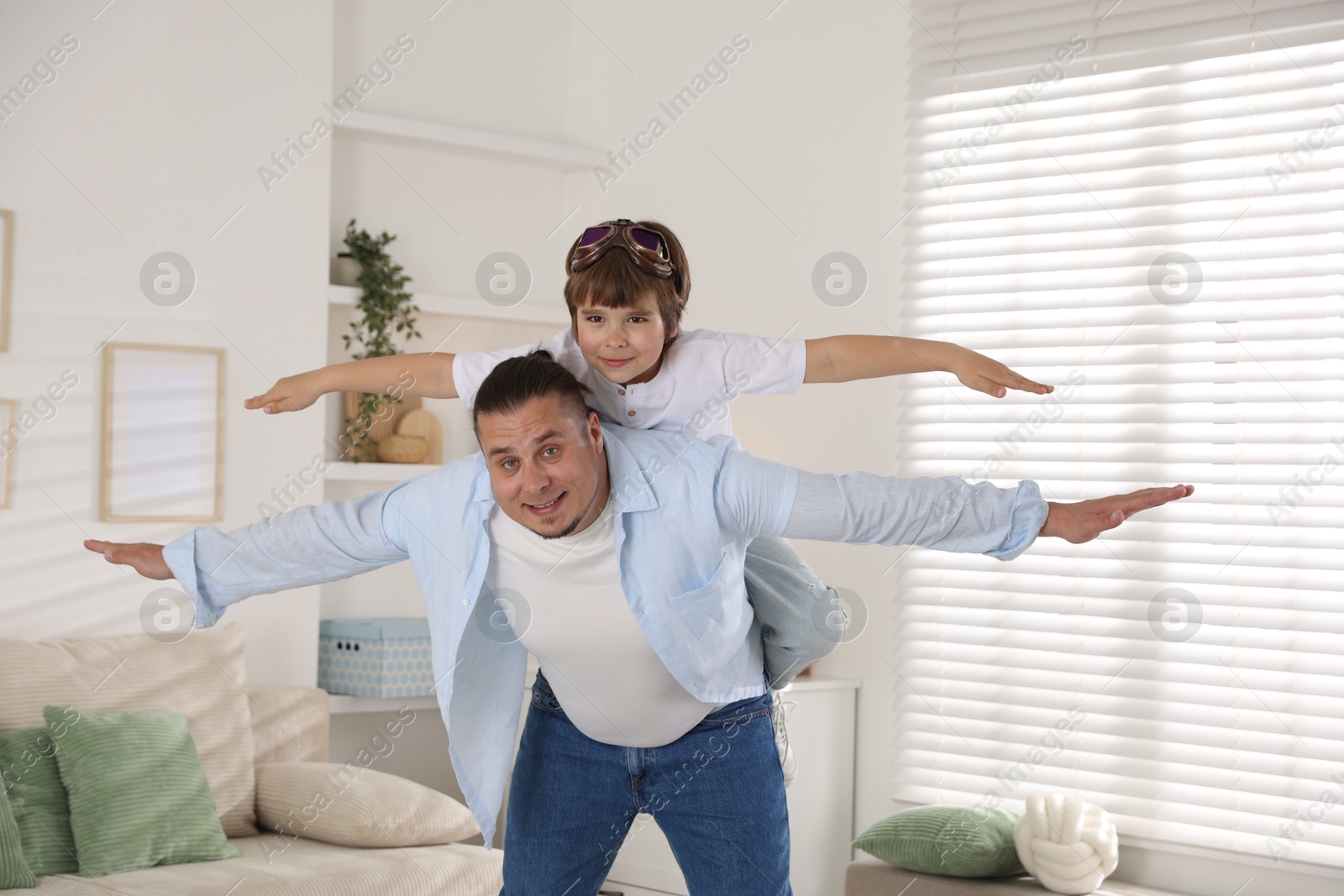 Father and his son spending time together at home Photo of Father and his son spending time together at home