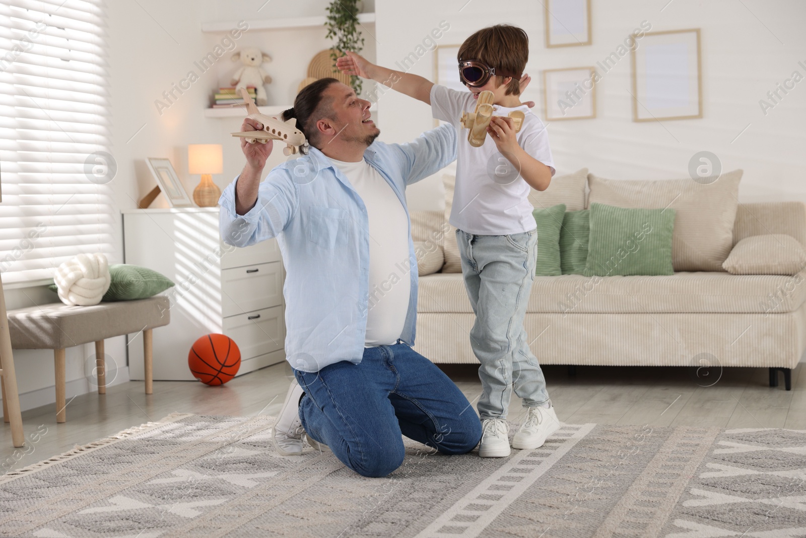 Father and his son spending time together at home Photo of Father and his son spending time together at home