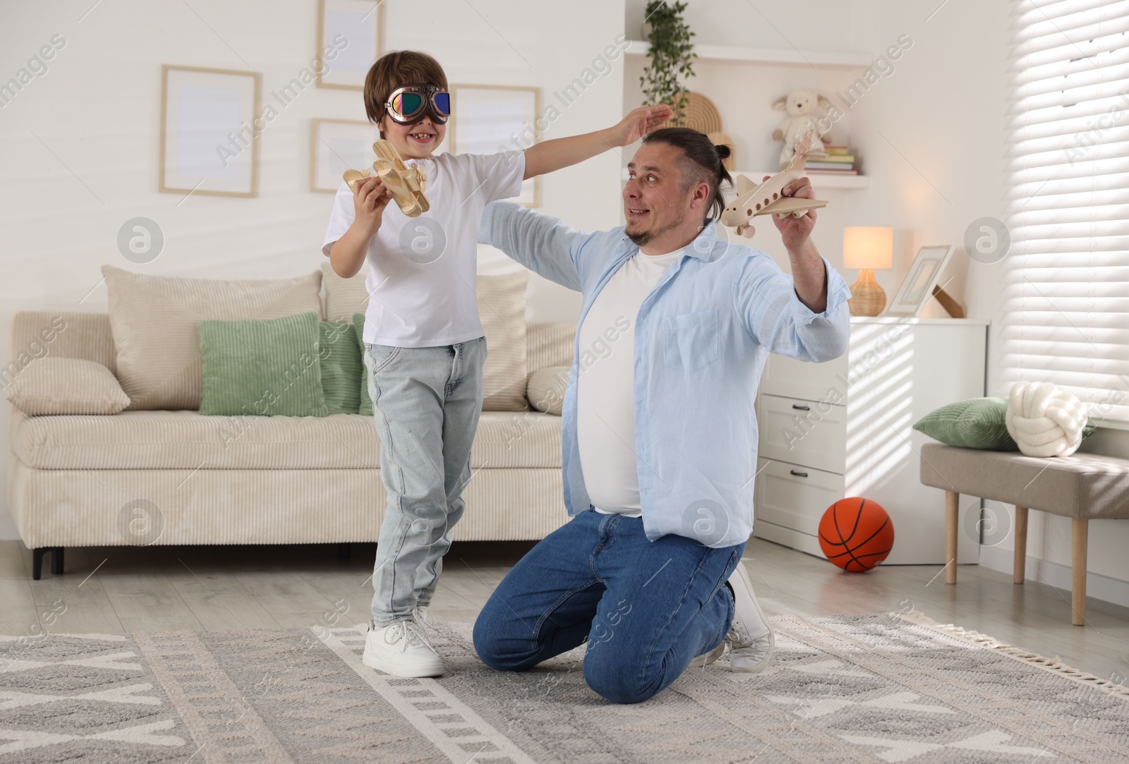 Father and his son spending time together at home Photo of Father and his son spending time together at home