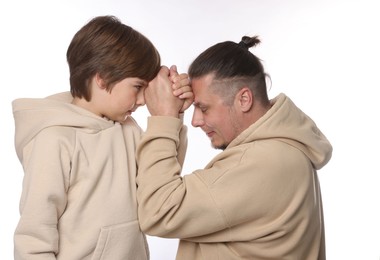 Photo of Father with his son on white background