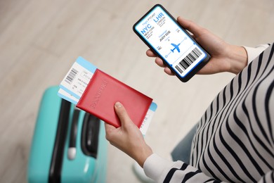 Image of Tourist holding mobile phone with e-ticket for airplane and passport indoors, closeup