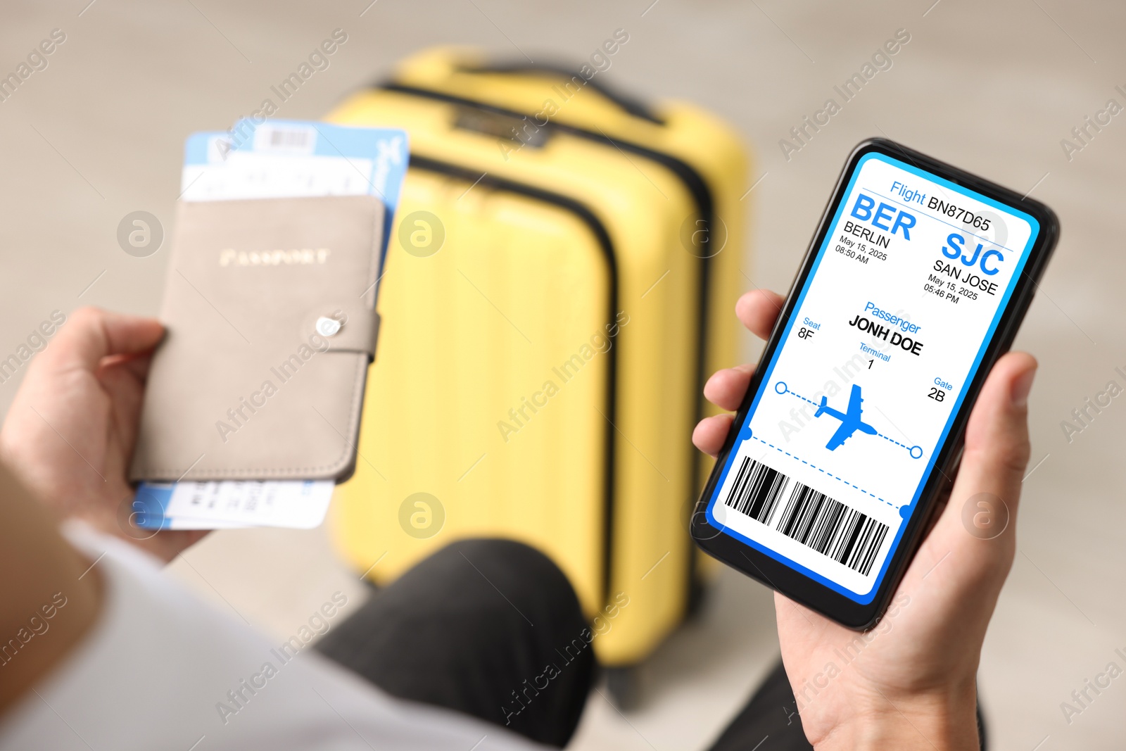 Tourist holding mobile phone with e-ticket for airplane and passport indoors, closeup Image of Tourist holding mobile phone with e-ticket for airplane and passport indoors, closeup