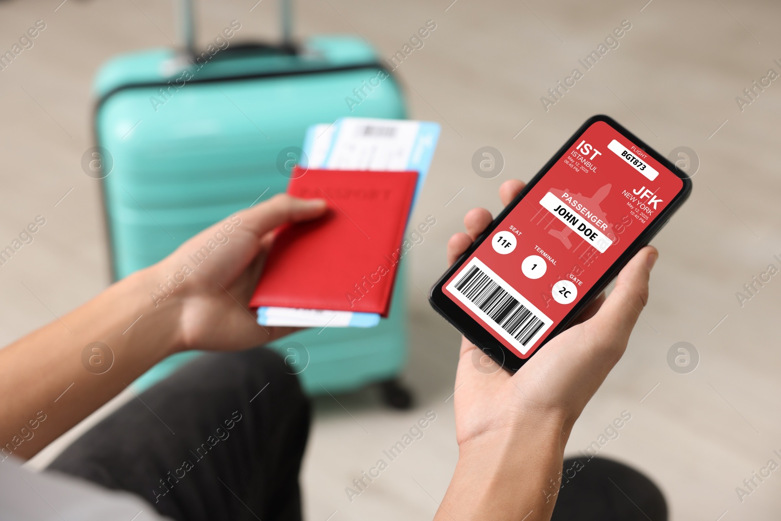 Tourist holding mobile phone with e-ticket for airplane and passport indoors, closeup Image of Tourist holding mobile phone with e-ticket for airplane and passport indoors, closeup