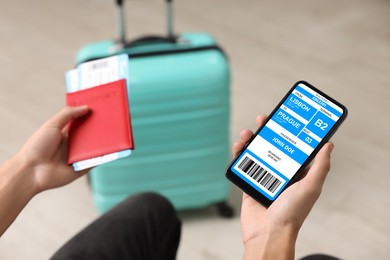 Image of Tourist holding mobile phone with e-ticket for bus and passport indoors, closeup