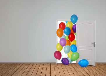 Image of Many bright balloons flying into open door. Festive decoration for birthday party or other celebration