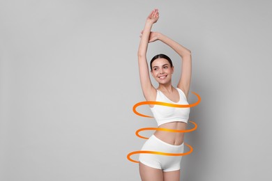 Image of Beautiful woman with perfect figure on light grey background, space for text. Ribbon around her body. Result of healthy lifestyle, diet, sport trainings