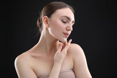 Photo of Portrait of beautiful woman on black background