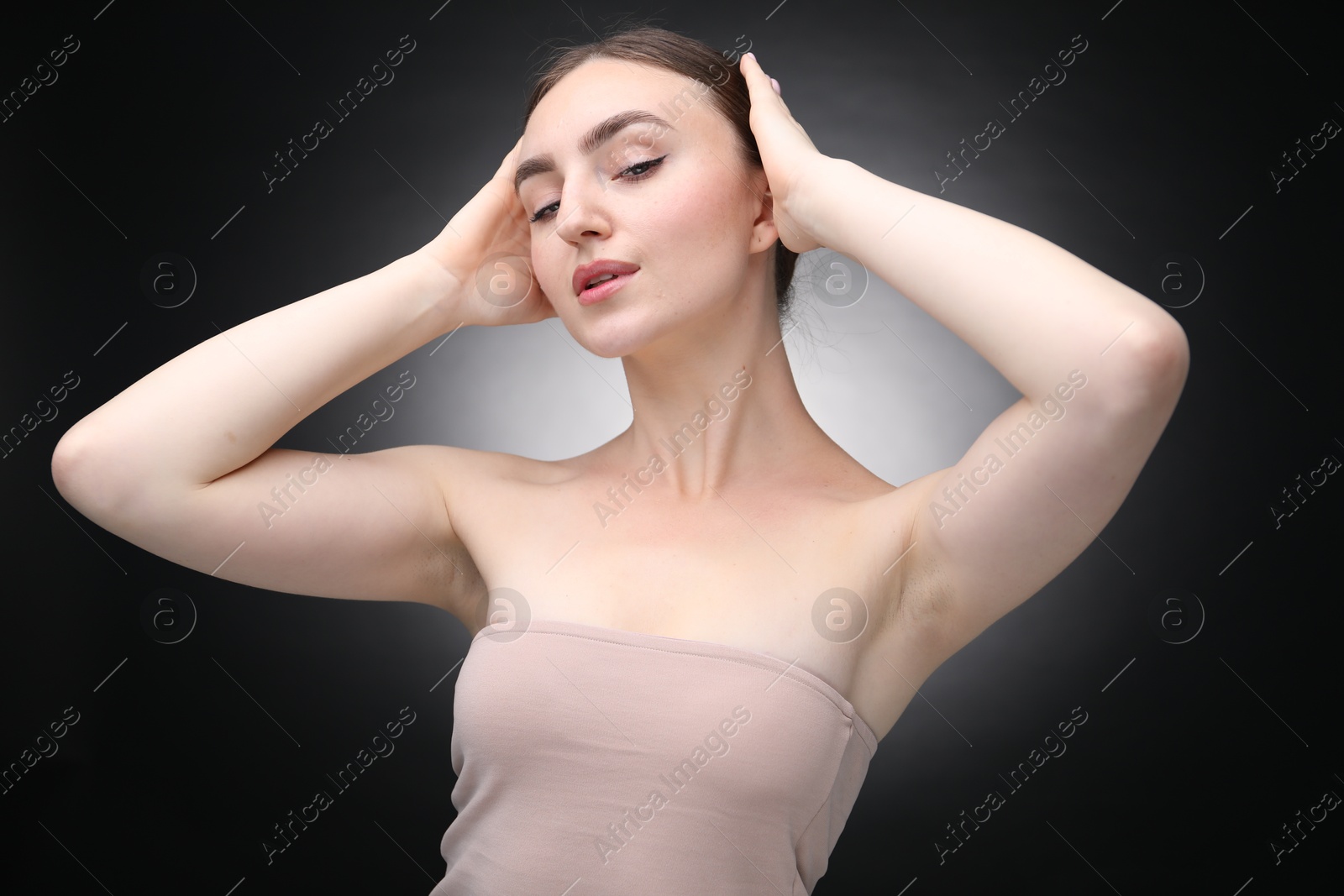 Portrait of beautiful woman on black background Photo of Portrait of beautiful woman on black background