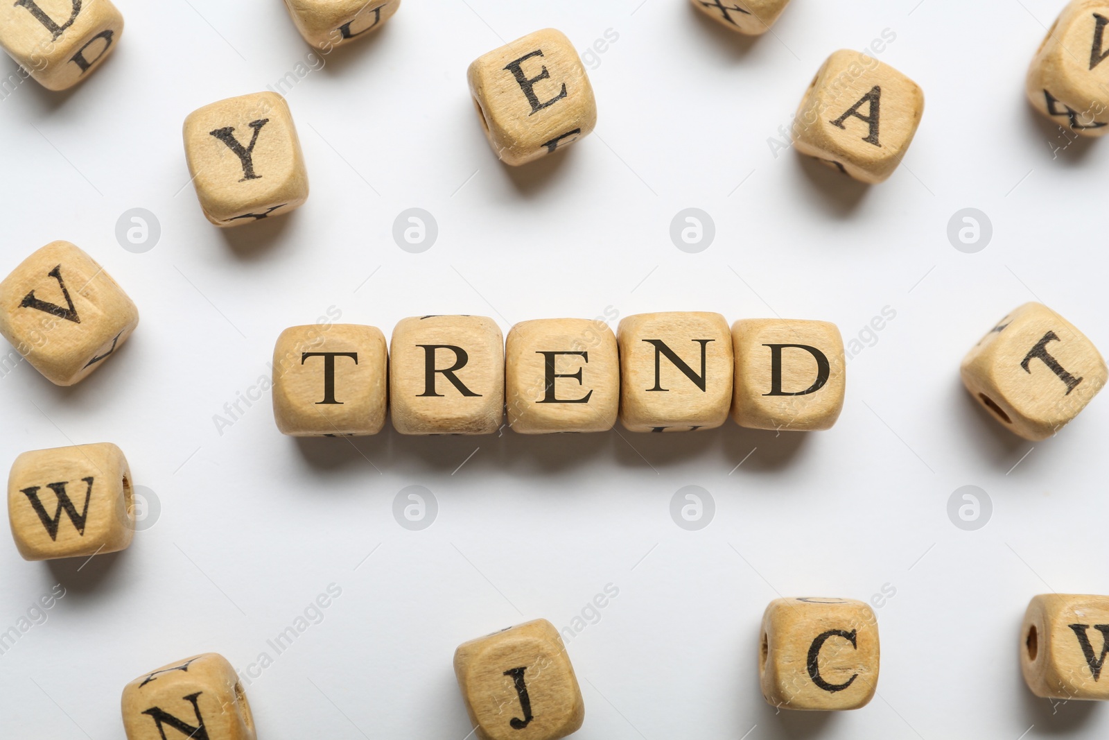 Word Trend made of wooden cubes with letters on white background, top view Image of Word Trend made of wooden cubes with letters on white background, top view